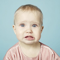 Baby girl showing her teeth